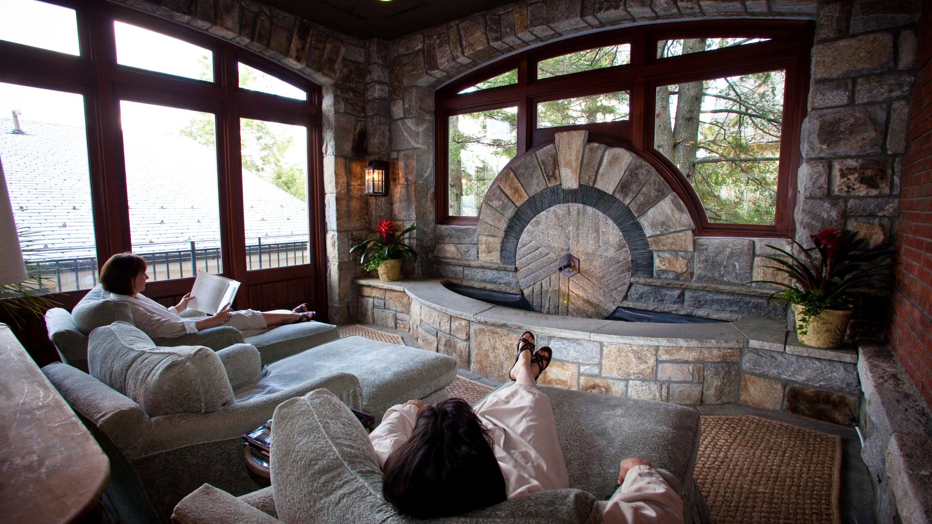 A Room Filled With Furniture And A Fire Place