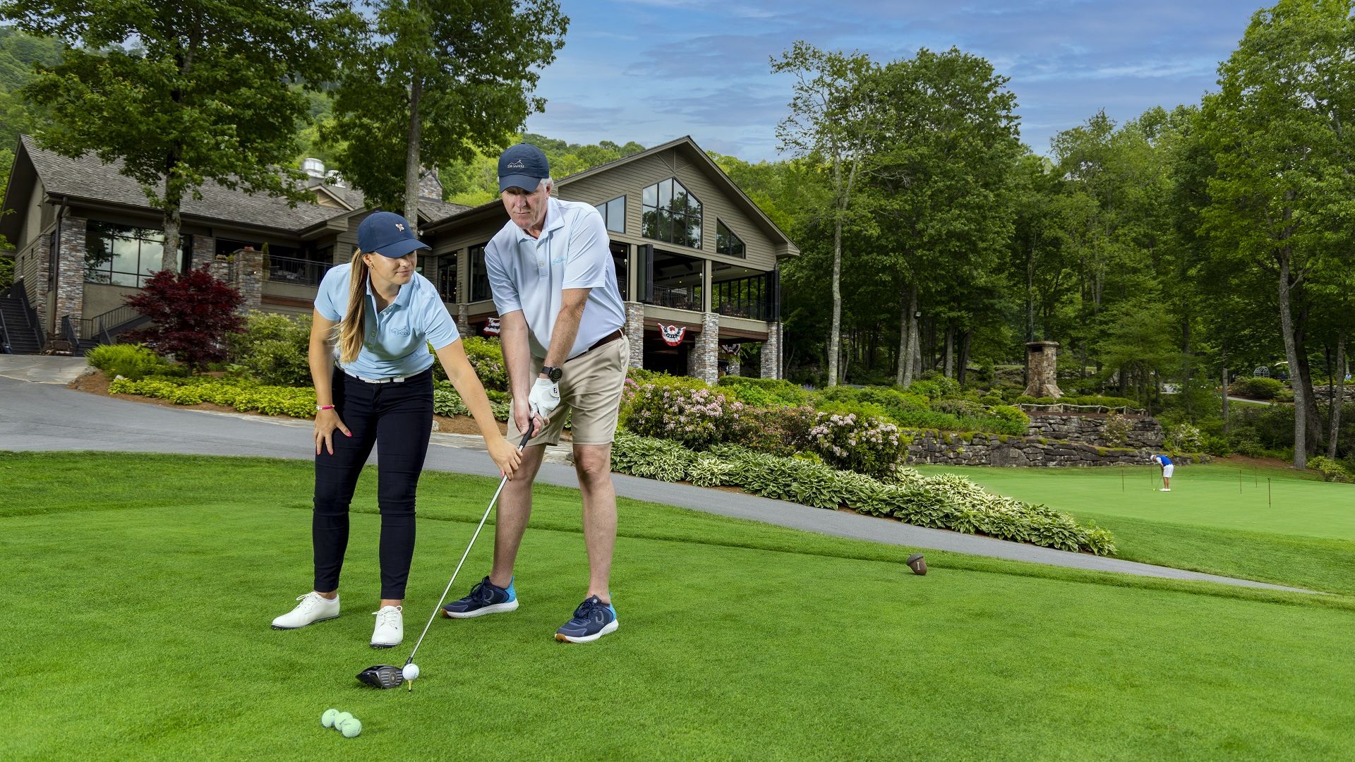 A Man And Woman Playing Golf