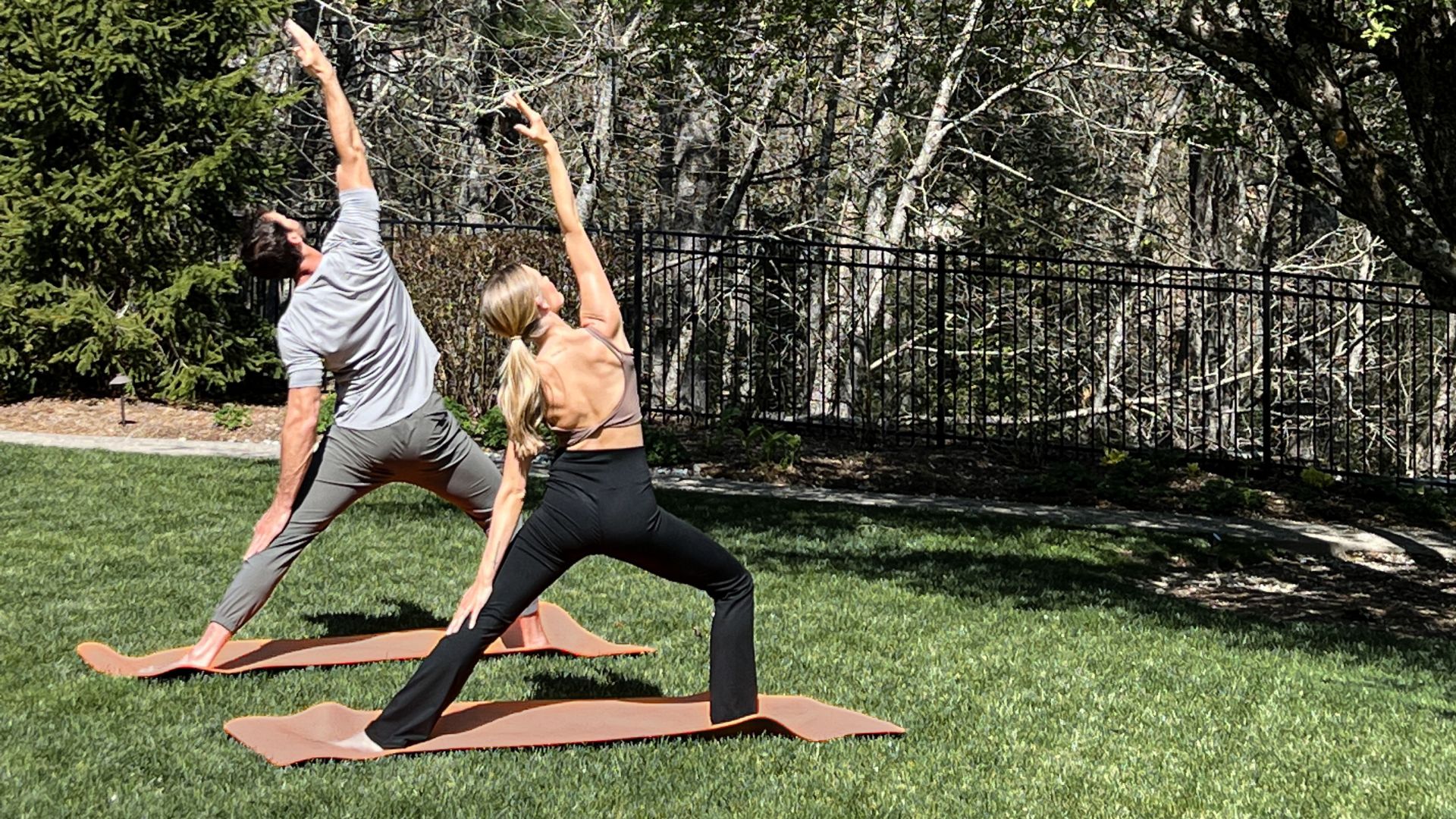 A Man And Woman Doing Yoga